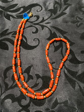 Red coral oblong beads and 12 carat gold filled beads and clap.  24 inches