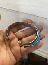 Heavy sterling silver Tufa  bracelet with turquoise and coral chips