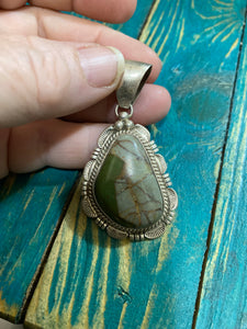 Boulder Turquoise Pendant with great matrix