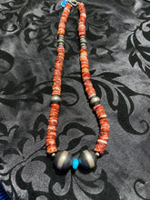 This Spiny oyster necklace is 20 inches. It has disc and Navajo pearls plus one piece of sleeping beauty turquoise.