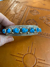 Sterling Silver bracelet with 7 Kingman stones.