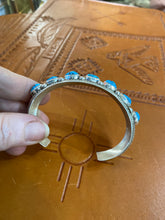 Sterling Silver bracelet with 7 Kingman stones.