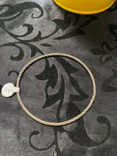 The sterling silver plain with a twist bangle