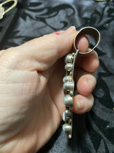 “The Freshwater Pearl and multiple Gem Stones set in a sterling silver cross
