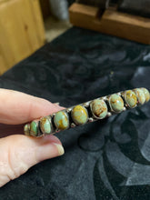 Turquoise oval bangle 10 mm. This bangle has a variety of green colors.