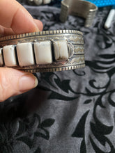 White Buffalo Band cuff bracelet.