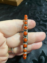 The small round stone Coral bangle bracelet