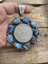 Large Golden Hill turquoise with a silver coin pendant