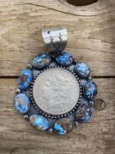 Large Golden Hill turquoise with a silver coin pendant