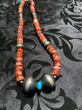 This Spiny oyster necklace is 20 inches. It has disc and Navajo pearls plus one piece of sleeping beauty turquoise.