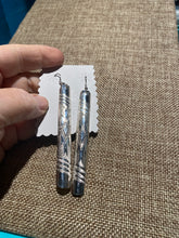 The long slender sterling silver earrings