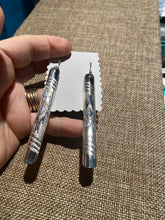 The long slender sterling silver earrings