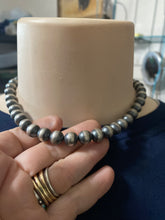 A 16 inch 10 mm Navajo pearls necklace with a 3 inch extender