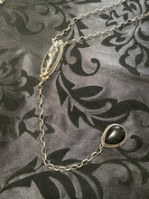 The white bronze and black Onyx, long lariat necklace
