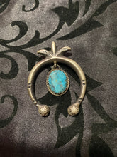 The Naja pendant with a turquoise center drop