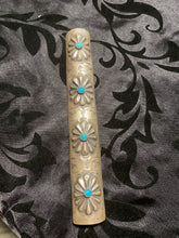The long sterling silver Native American made with turquoise ponytail jewelry