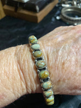 Turquoise oval bangle 10 mm. This bangle has a variety of green colors.