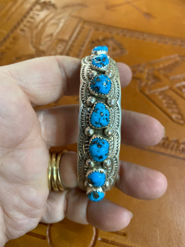 Sterling Silver bracelet with 7 Kingman stones.