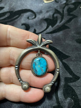 The Naja pendant with a turquoise center drop