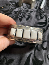 White Buffalo Band cuff bracelet.