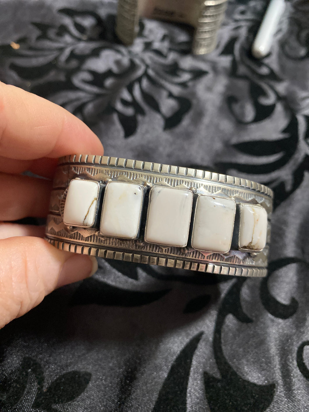 White Buffalo Band cuff bracelet.