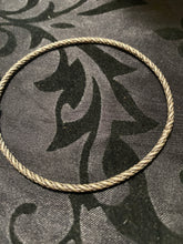 The sterling silver plain with a twist bangle