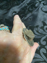 Sterling silver, cowboy hat rings with a snake eye turquoise
