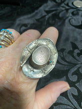 Sterling silver, cowboy hat rings with a snake eye turquoise