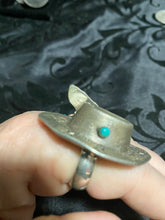 Sterling silver, cowboy hat rings with a snake eye turquoise