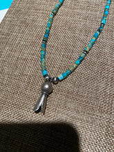 Turquoise Heishi beads beads with a silver squash bloom Pendant