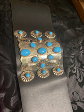 Leather,Sterling silver concho and sleeping beauty Turquoise in a beautiful bow guard!