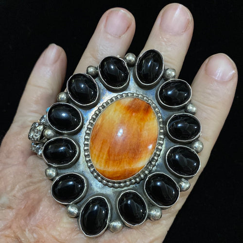 Black onyx and orange spiny ring