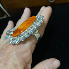 Orange spiny oyster surrounded by stars
