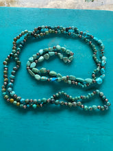 One long single stand of turquoise with Navajo pearls included