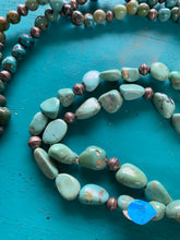 One long single stand of turquoise with Navajo pearls included