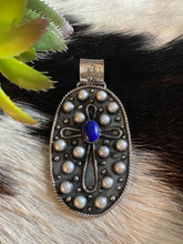The freshwater pearls and lapis queen pendant