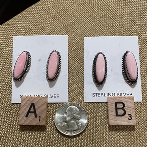 The oval Pink Conch earrings