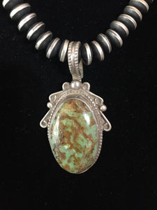 Vintage small hook Nevada green pendant.