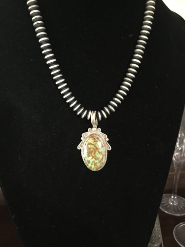 Vintage small hook Nevada green pendant.