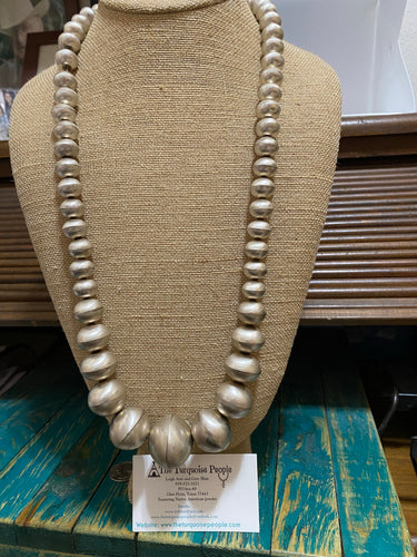 “The Jumbo Monica beads”