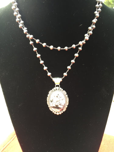 Smaller white Buffalo Turquoise oval pendant #1