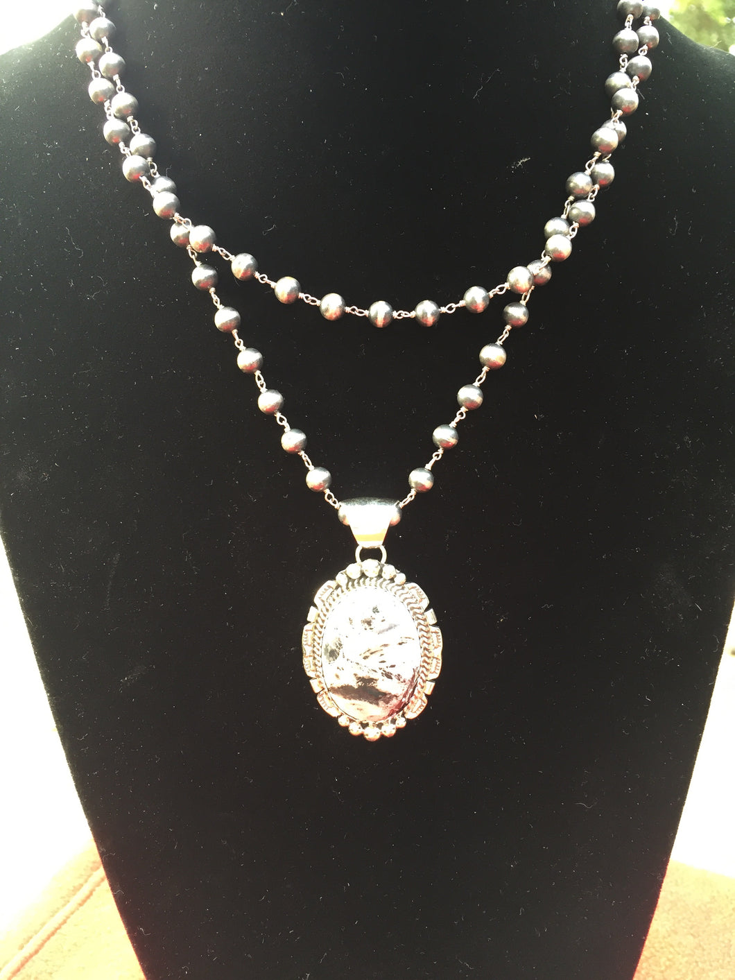 Smaller white Buffalo Turquoise oval pendant #1