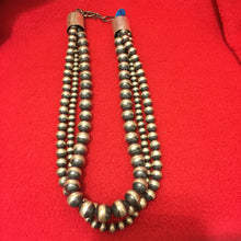 3 strand 18 inch Navajo pearl necklace with large bell