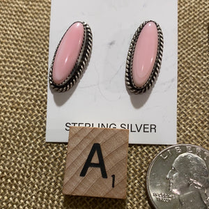 The oval Pink Conch earrings